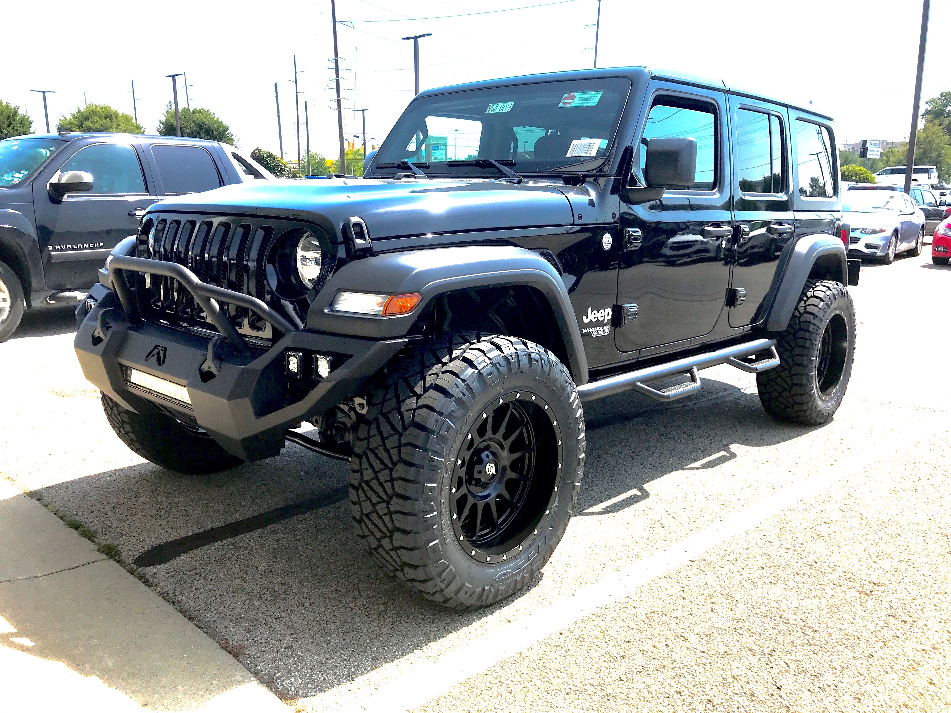 lifted JK Wrangler 2014 Dune color with Atlas bumpers from DSI